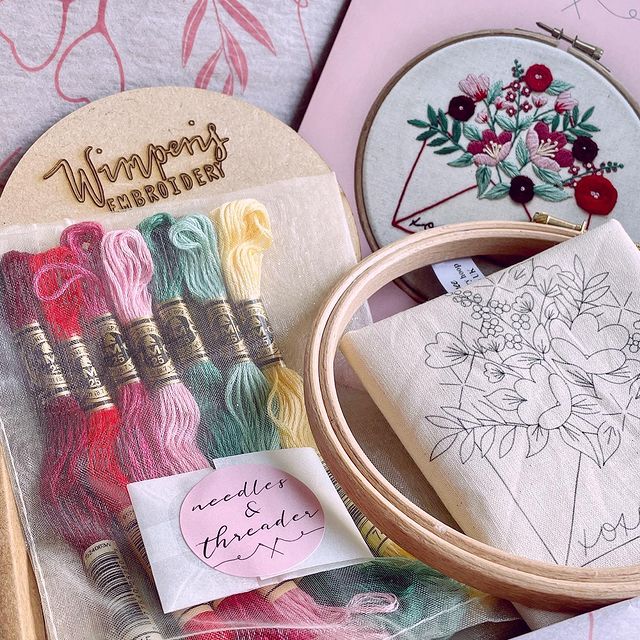 Close up of Wimperis Embroidery kit showing DMC thread, needles, embroidery hoop and printed design