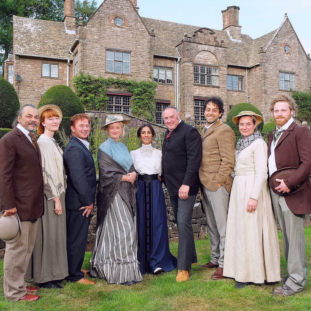 A group of participants in the BBC series the Victorian House of Arts and Crafts wearing  Victorian costume 