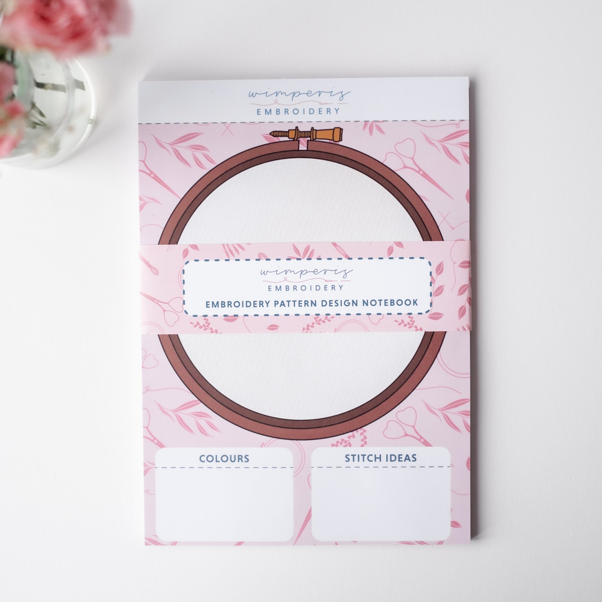 Embroidery pattern design notebook, features drawn embroidery hoop, a space to put colour options and one to put stitch type ideas.